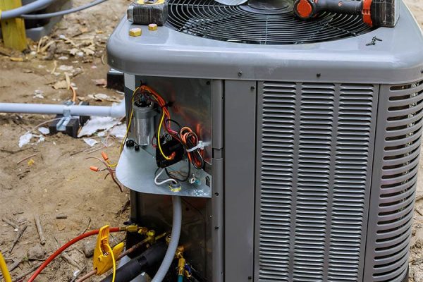 Air conditioning technician servicing of preparing to install new air conditioner